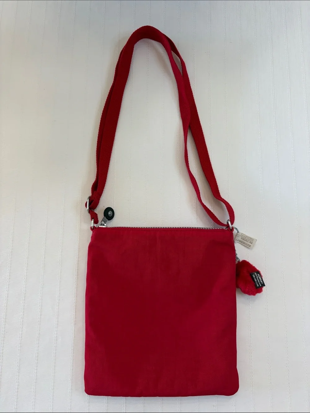 Kipling Red Crossbody with Playful Pom Charm
